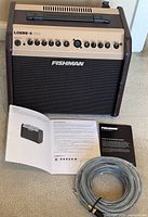 Amplifier front with cable and manuals