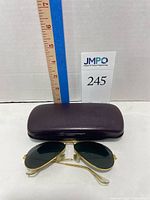 Sunglasses and closed hard case side by side