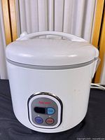 Front view showing full rice cooker and control panel