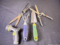 All five garden tools laid out