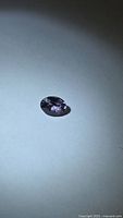 Front view of oval purple spinel