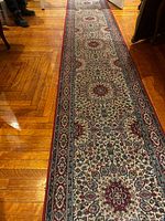Runner laid out on hardwood floor showing full pattern and colors