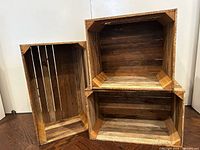 Front view showing three different-sized crates side by side and stacked