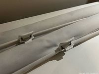 Folded blind sections showing integrated white mounting clips