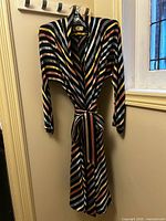 Front view of striped wrap dress with belt