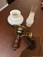 Wall sconce with both glass shades displayed