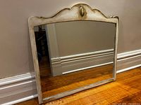 Front view of mirror showing frame shape and finish