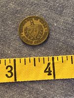 Obverse of 1943 Cuban 5 centavos coin with shield design