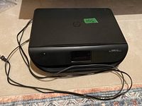 Top view of HP Envy 4522 printer with power cord