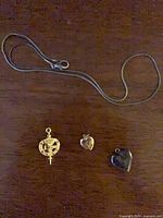 Overview of chain and three pendants/pin