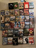 Full layout of 36 DVD cases and 3 VHS tapes