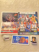 All items together: poster, sticker album, stickers, keychain, pamphlet