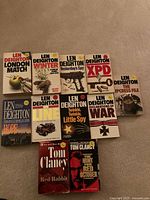 Front covers of all 11 novels displayed