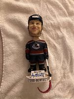 Front view of Todd Bertuzzi bobblehead showing uniform, stick and base text