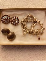 Necklace and both pairs of earrings in presentation box