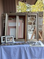 Overall lot with large frames, mats, small frames, easel, inserts