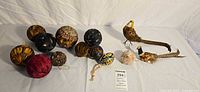 Full lot showing feather balls, egg, pom, birds