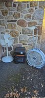 Two pedestal fans, EdenPure heater, round floor fan, floor lamp