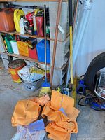 Pile of ShamWow cloths, broom, squeegee visible
