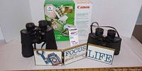 Lot overview: boxed Canon Selphy CP220 printer, two binoculars, three wooden signs