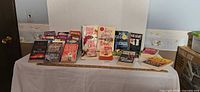 Overall view of the lot showing roughly two dozen books on a table