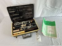 Clarinet pieces, case interior, accessories and instruction book visible