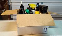 Box containing assorted chemical containers