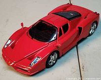 Three-quarter front view of red Maisto Ferrari Enzo die-cast car