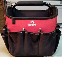 Front view of Husky open-top tool tote showing exterior pockets and handle