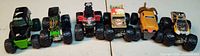 Front view of all six monster truck toys lined up