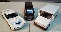 Three diecast vehicles grouped together