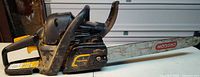 Left side view of Poulan Pro chainsaw showing Oregon bar