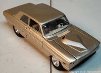 Front left perspective of die-cast car showing overall condition and color