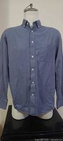 Front view of Alfred Sung chambray shirt on mannequin showing overall style