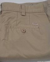 Back pocket view with IZOD tag and button closure