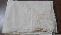 Tablecloth folded showing lace cutwork corner