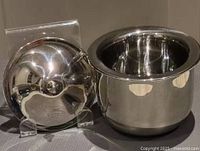 Both stainless steel chillers side by side with lids removed showing interiors