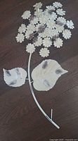 Full view of metal floral wall hanging