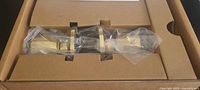 Boxed Amazon Basics Tulip door knob wrapped in plastic