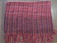 Full blanket laid flat showing overall weave and fringe
