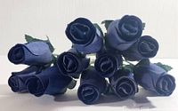 Front view of bundled navy wooden roses