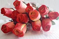 Close-up of wooden rose heads showing color gradient