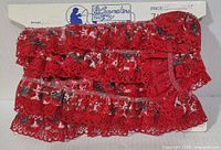 Full card showing unused red two-tier lace trim and Lacemakers branding.