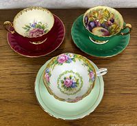 Top view of three teacup and saucer sets