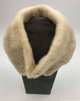Beige mink fur collar draped on display form