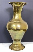 Full front view of hammered brass vase