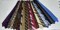 All 21 neckties fanned out for full view of patterns and colours