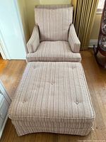 Armchair with matching ottoman, front view showing size and fabric pattern