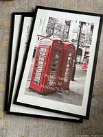 Front view showing three stacked black poster frames with sample image inside