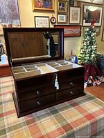 Jewelry box open showing mirror and compartments